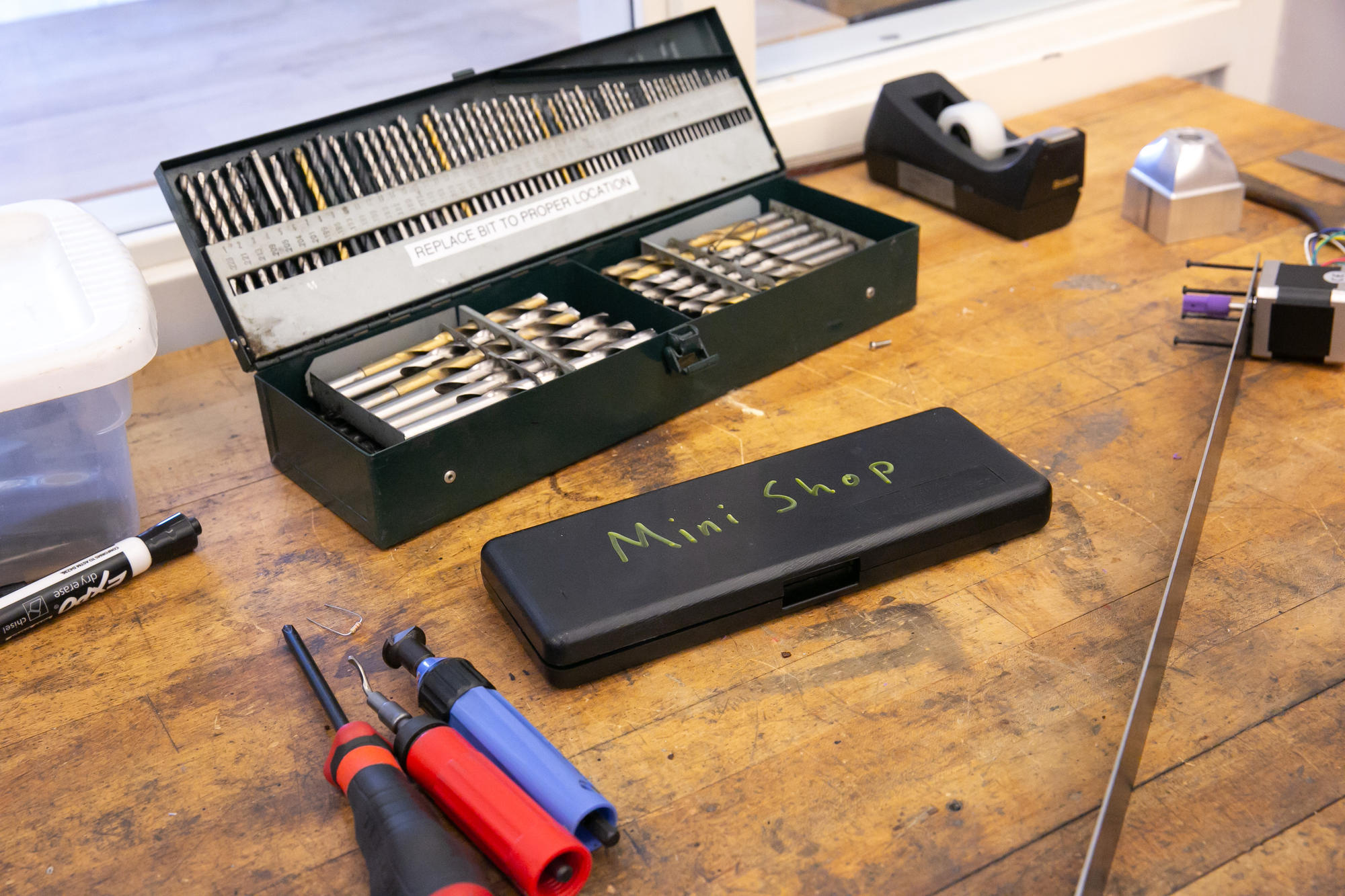image of storage unit on desk holding drill bits 