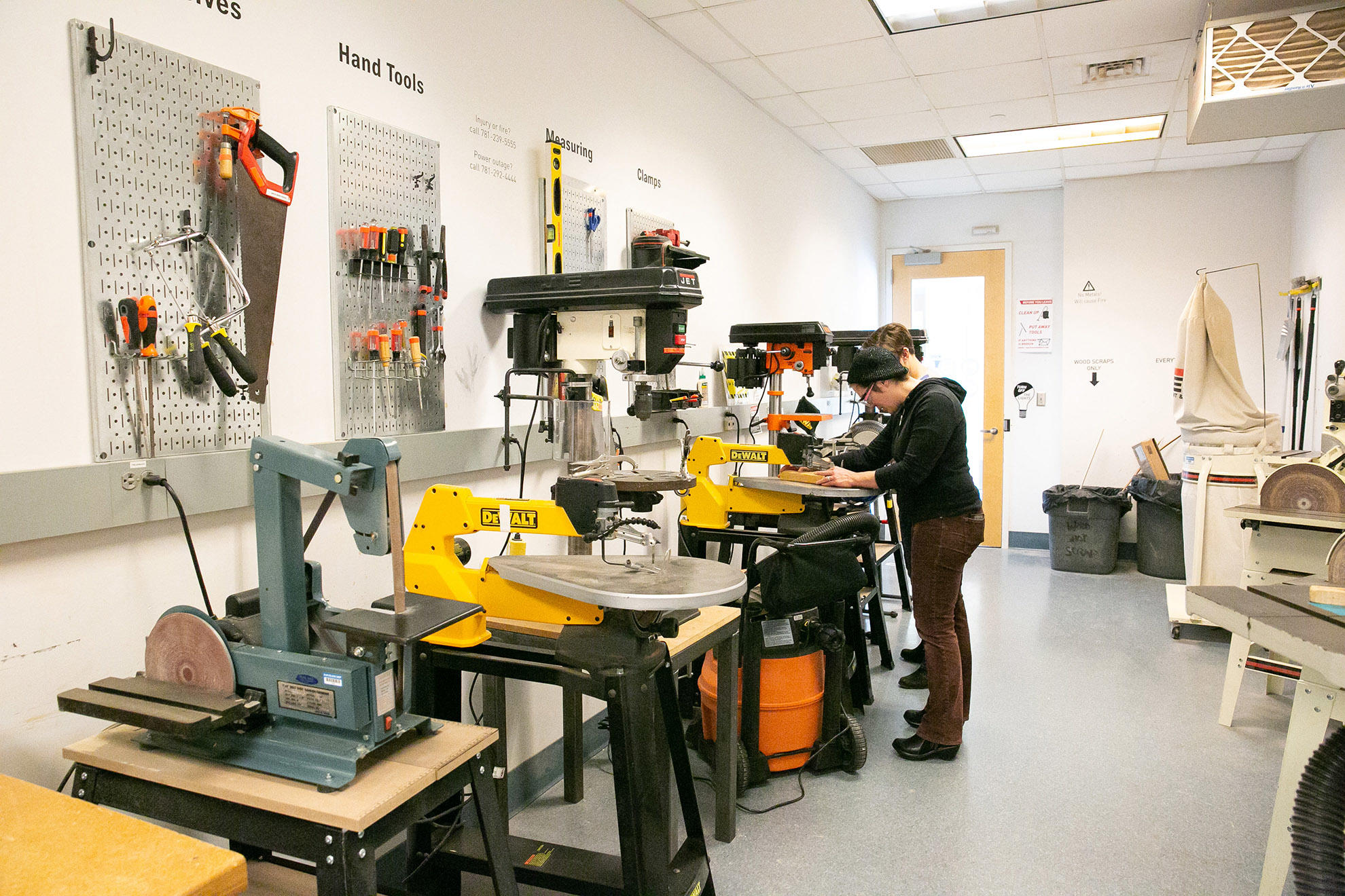 two Olin students working in the green shop