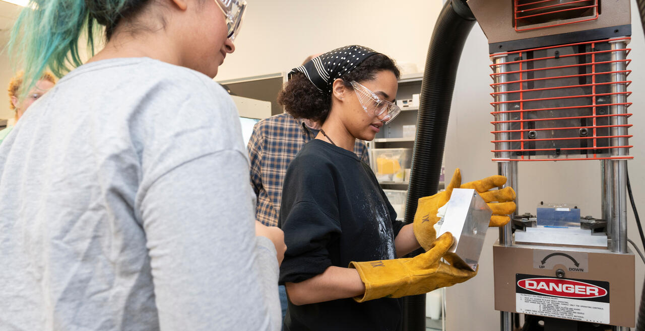 Two students working in the Olin shop 